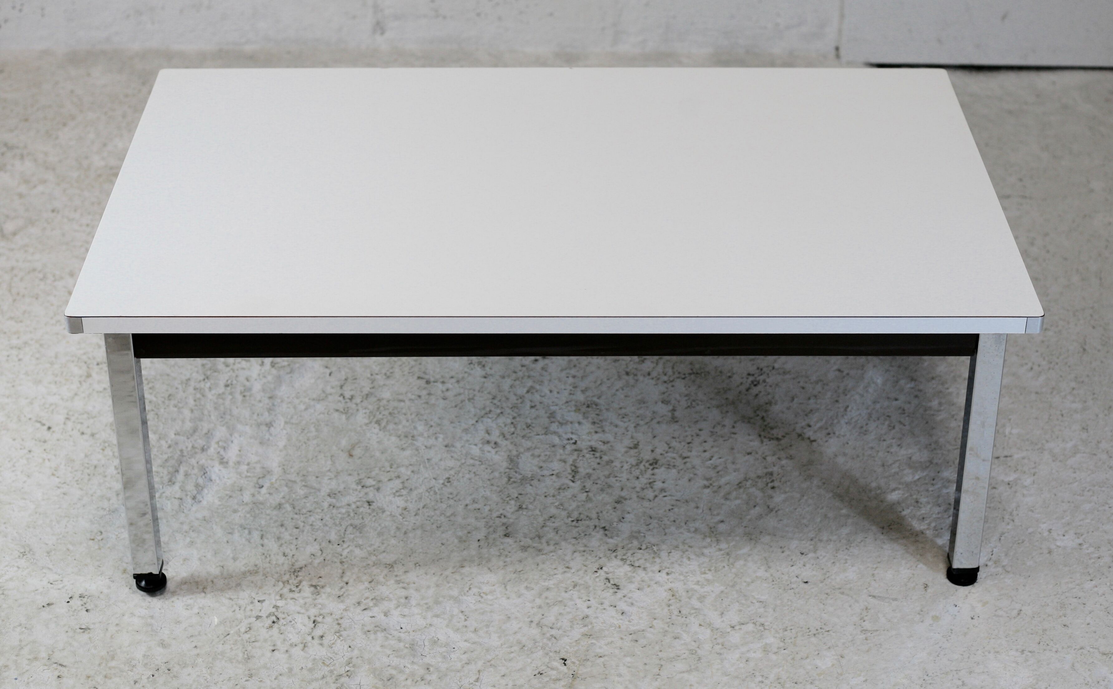 Coffee table chrome steel base, white melaminate top. France, circa 1970.