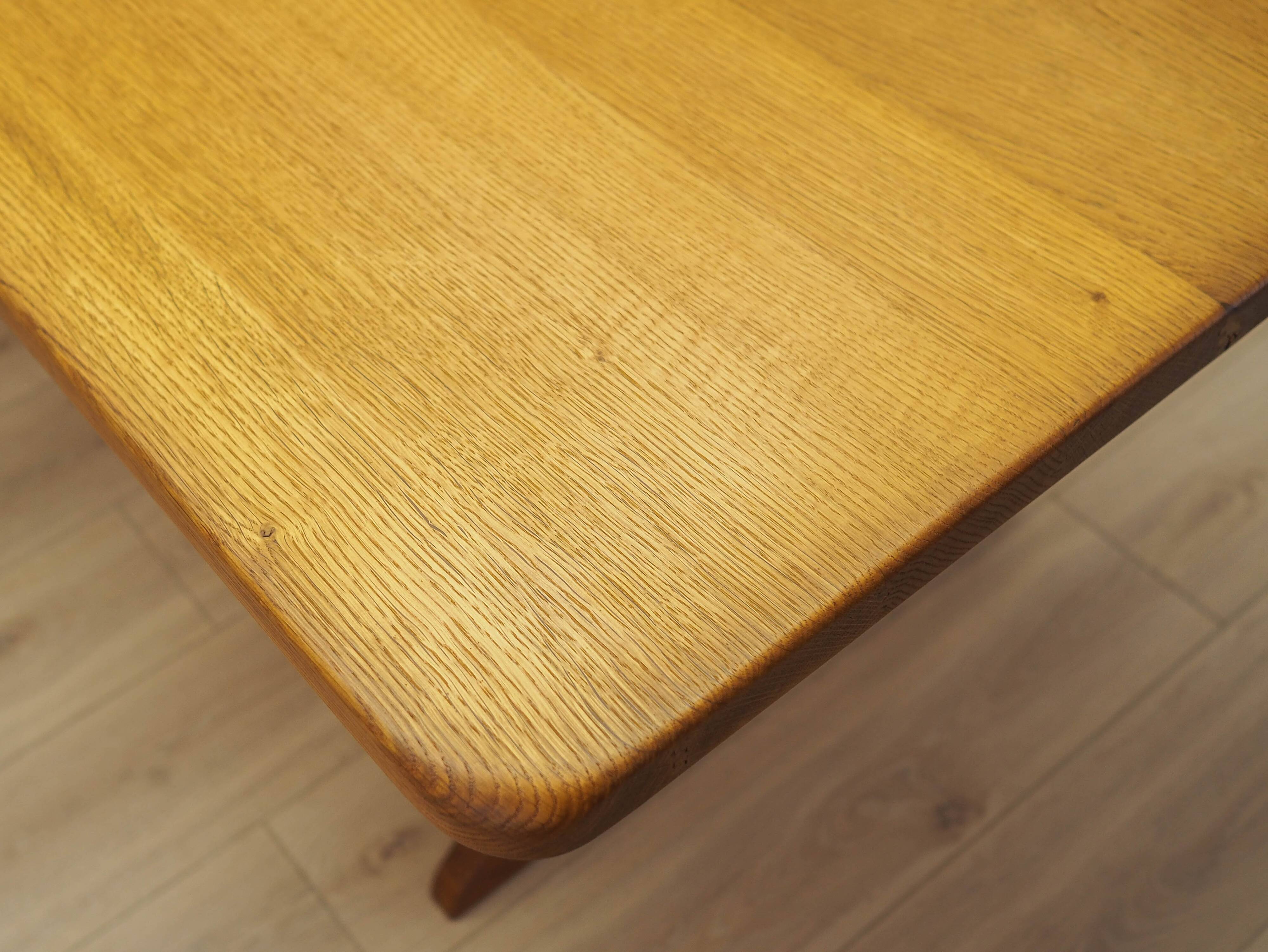 Solid oak dining table by Henning Kjærnulf, Denmark, 1960s
