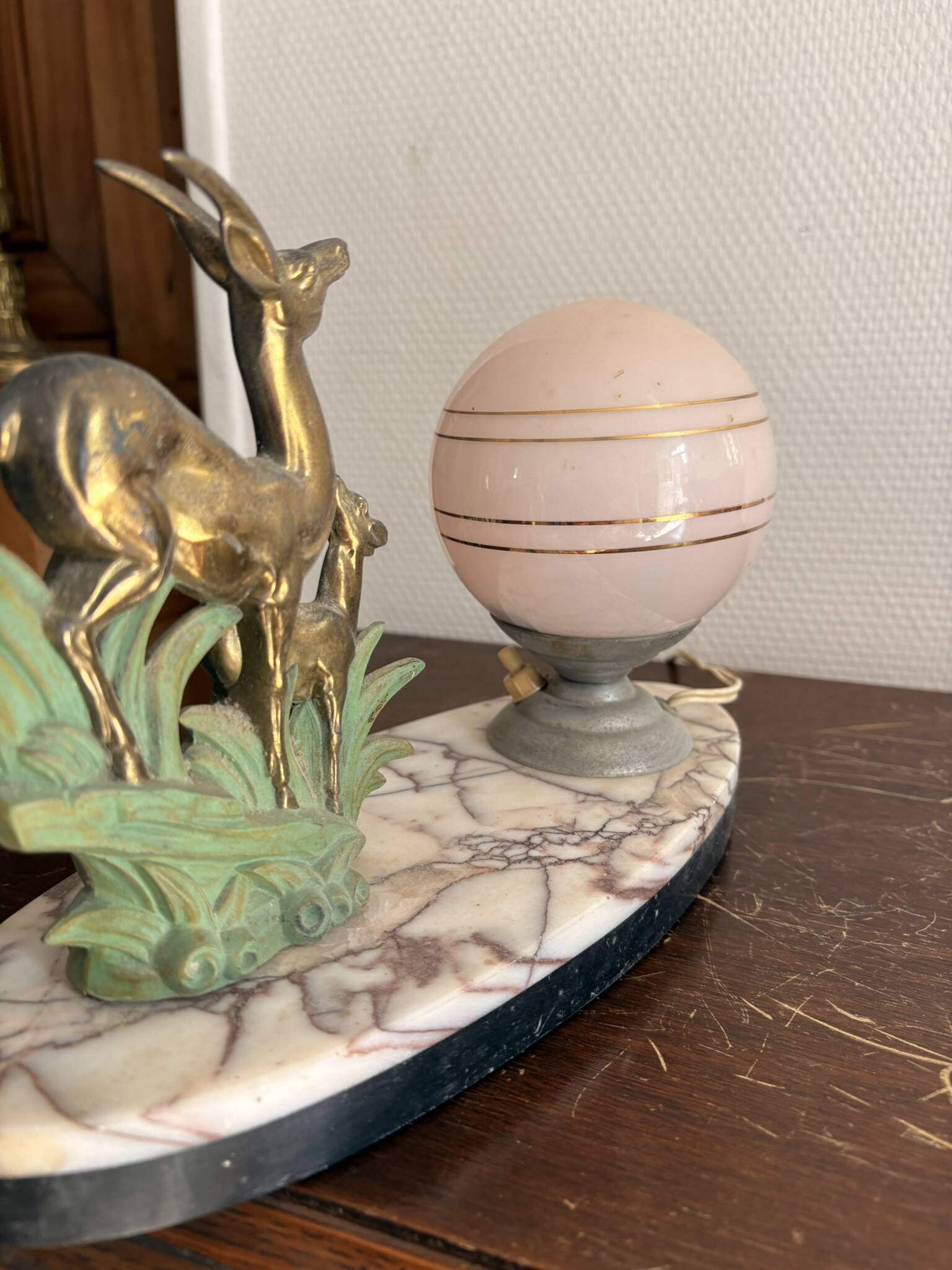 Antique Art Deco table lamp in marble and pink glass featuring a deer.