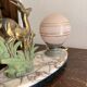 Antique Art Deco table lamp in marble and pink glass featuring a deer.