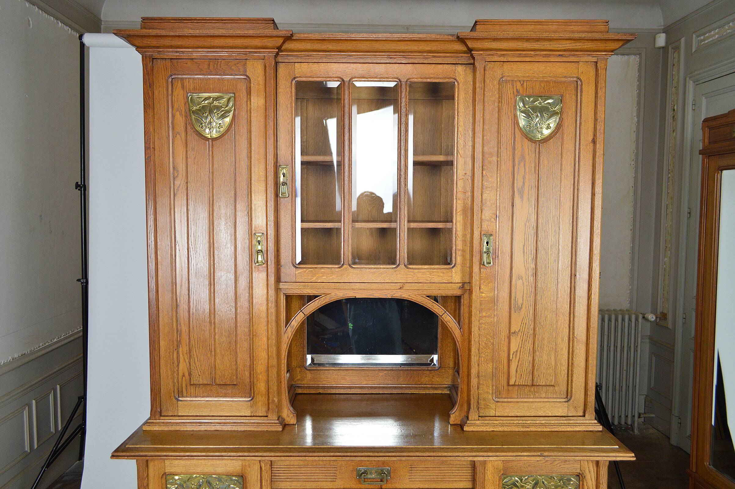 Art Nouveau oak buffet and dinanderie panels, circa 1910