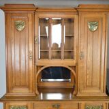 Art Nouveau oak buffet and dinanderie panels, circa 1910