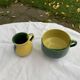 Enameled ceramic bowl and milk jug, two-tone yellow and green, vintage 1950