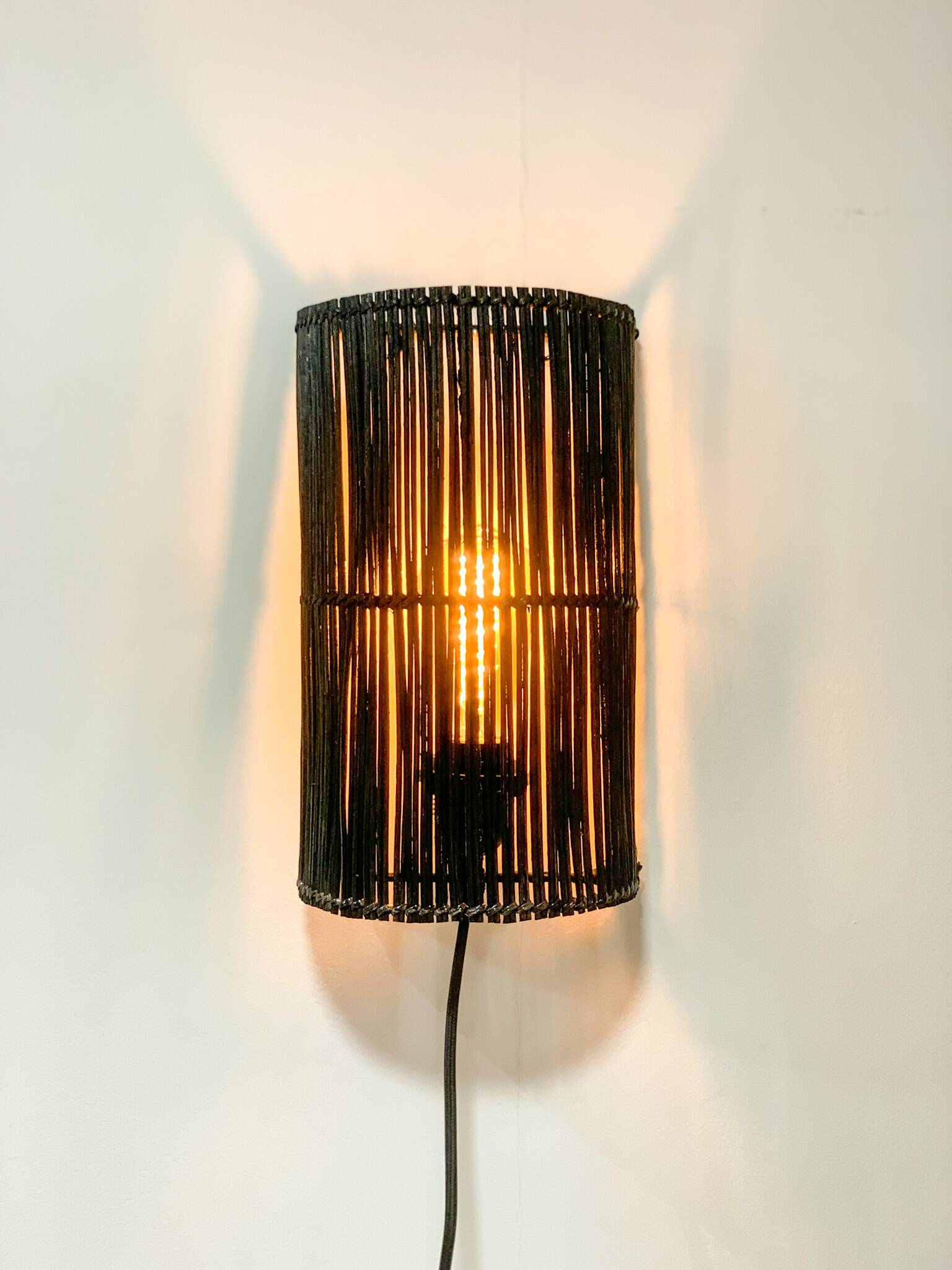 Black rattan wall light