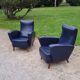 Paire de fauteuils des années 50 pieds compas recouverts de skaï bleu marine