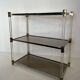 Lucite Shelf with Three Smoked Glass Shelves and Brass Ends. Work