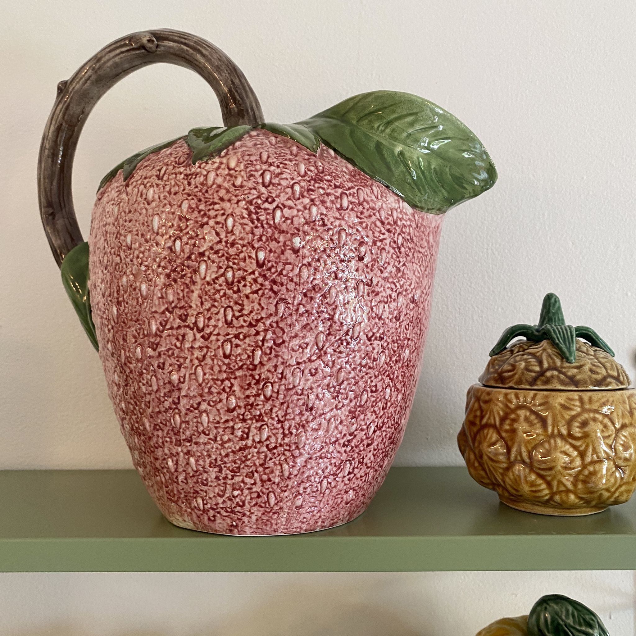 Set of ceramic fruits, a strawberry decanter and two lemon and pineapple jam jars