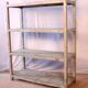 Teak bookshelf with original off-white patina.