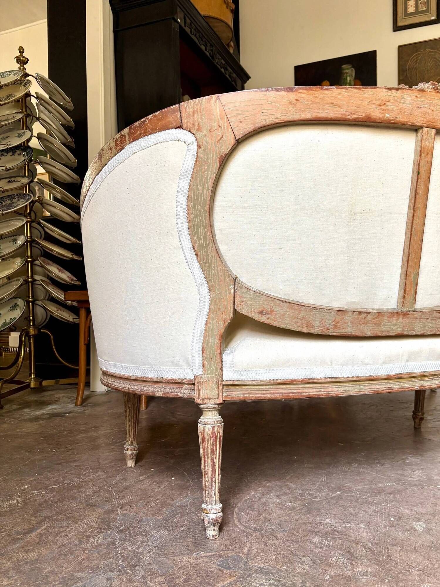 Two-seater basket bench in carved wood and beige mixed fabric, 18th century.