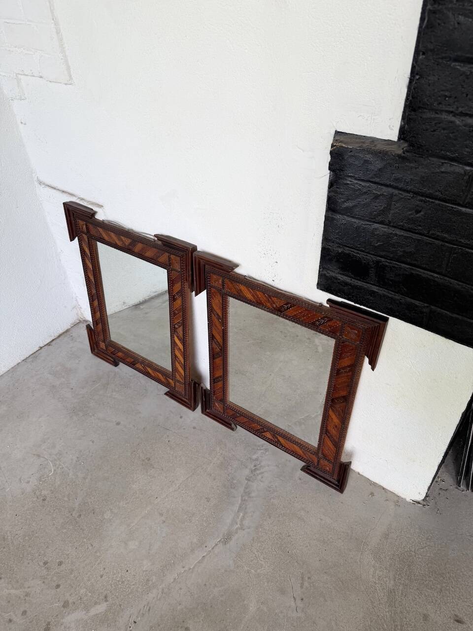 Pair of wooden mirrors in tramp art style