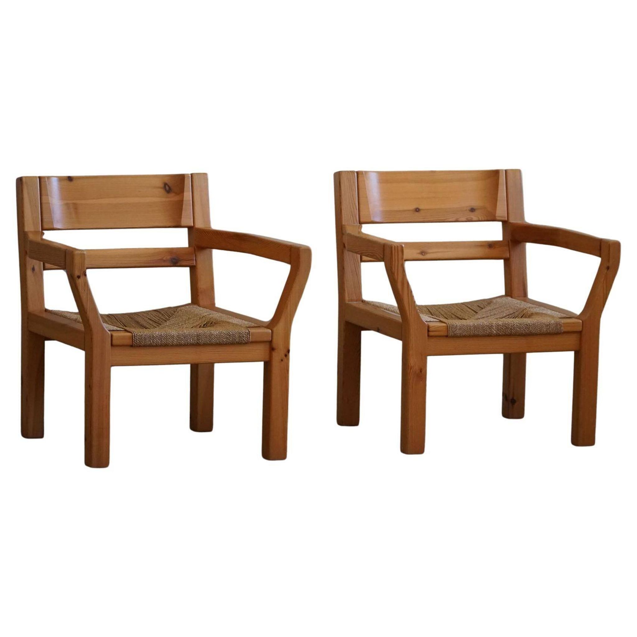 Tage Poulsen, a pair of brutalist chairs in pine and cord, Danish modern style, 1970s.