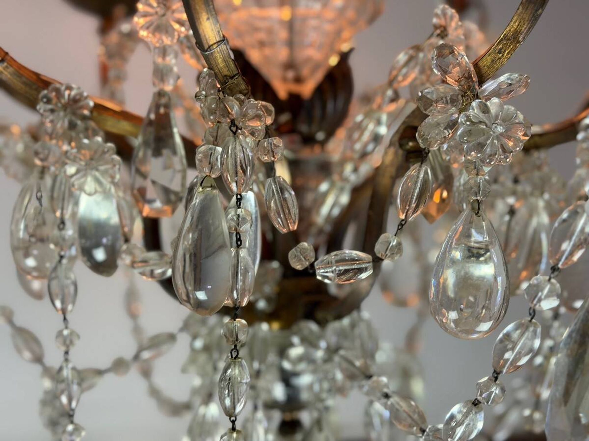 Bronze cage chandelier adorned with crystal drops, circa 1880