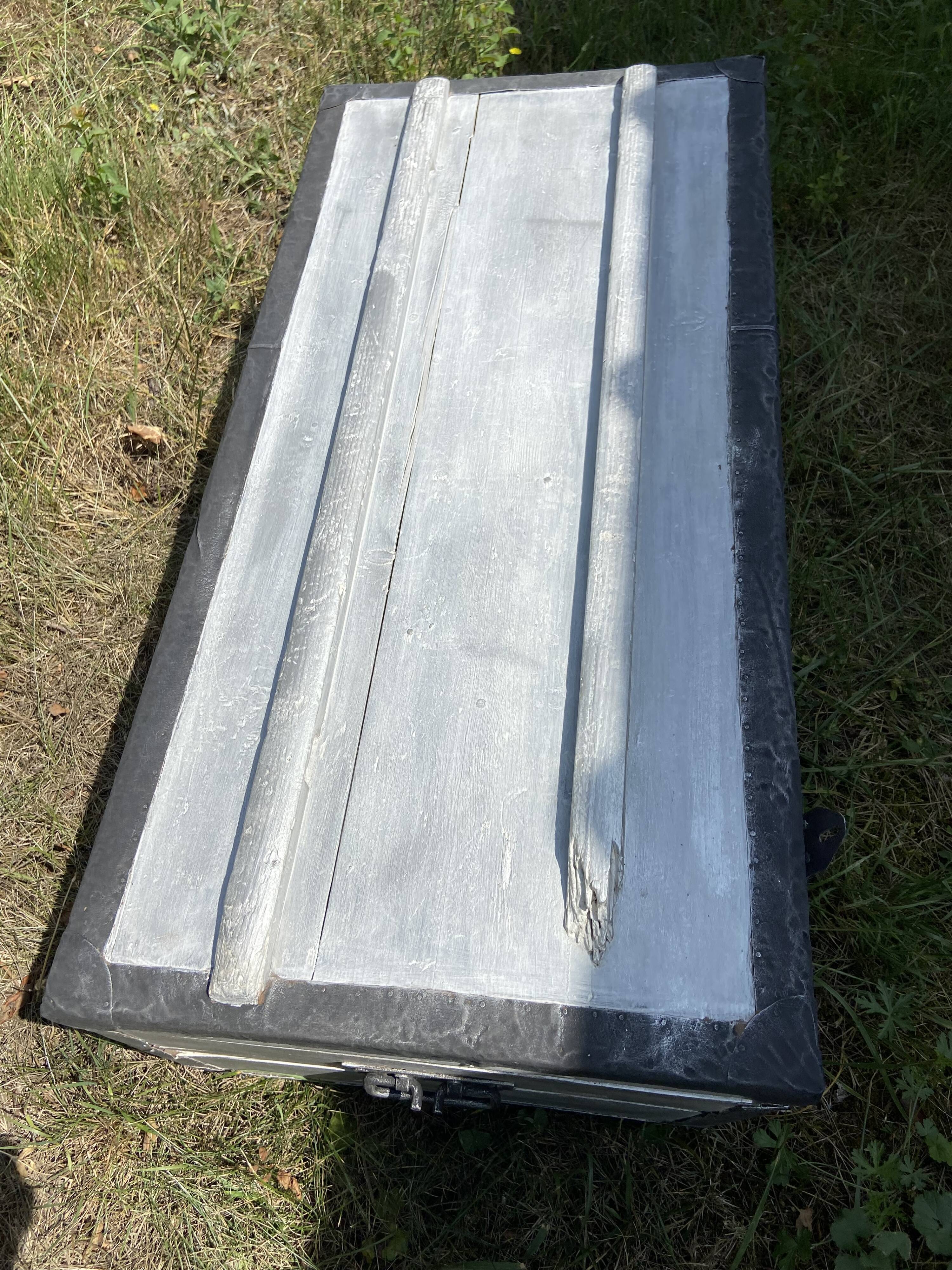 Restored wooden trunk patinated grey