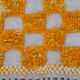 Yellow and white checkered Berber rug