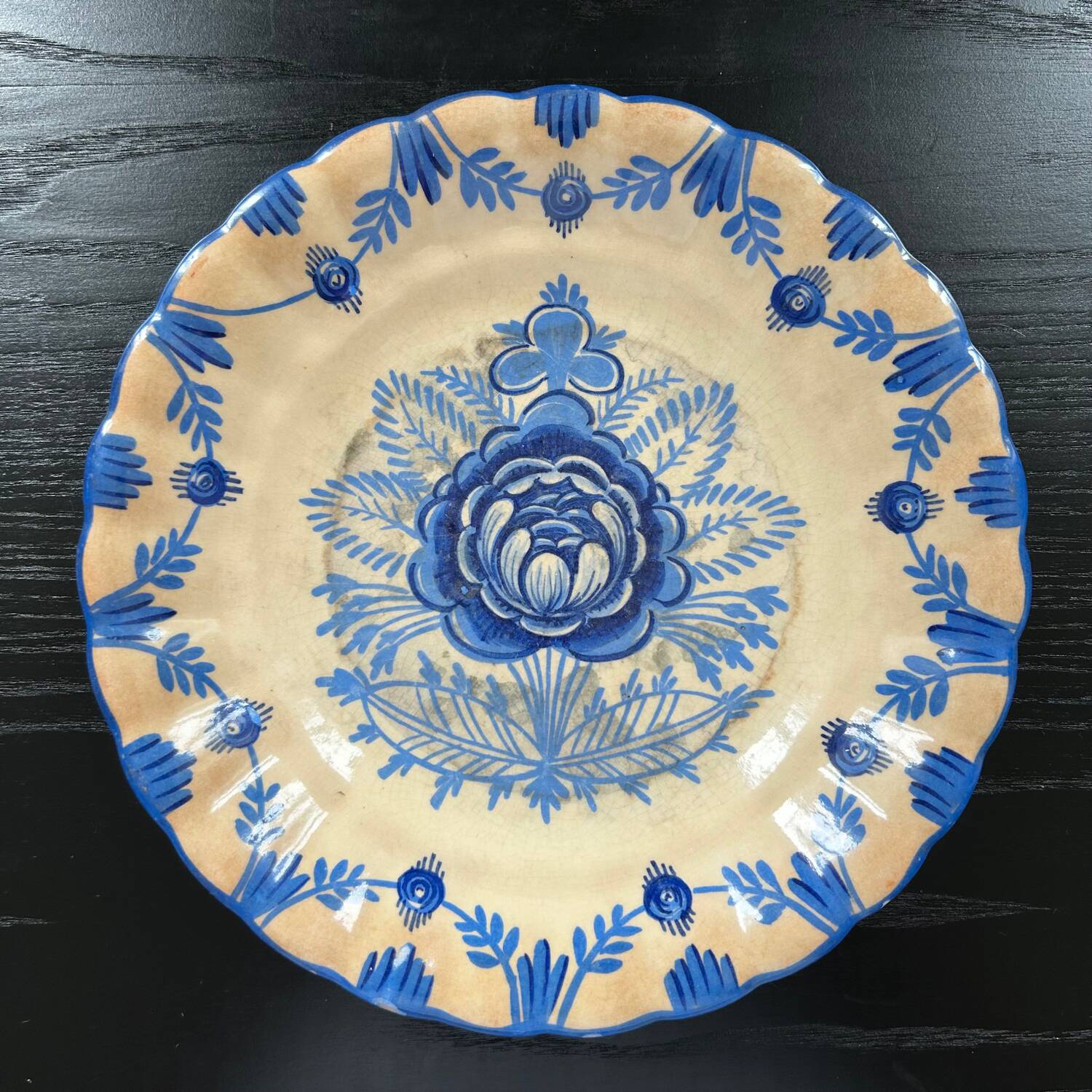 Old dish with blue floral decoration