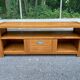 Solid pine wood TV unit stained with drawer and storage.