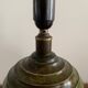 Art Deco table lamp in patinated bronze with eagles holding a globe, France 1940.