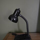 Black flexible desk lamp with built-in flashheld
