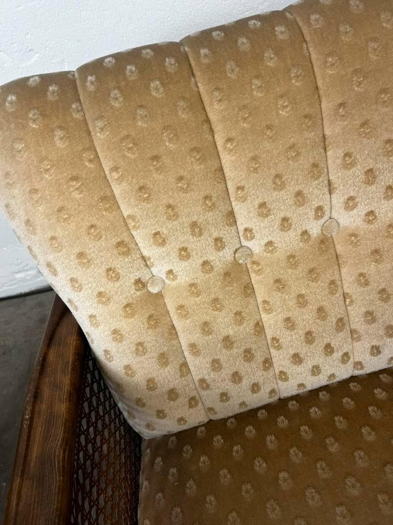 Vintage wooden armchair with rattan weaving.