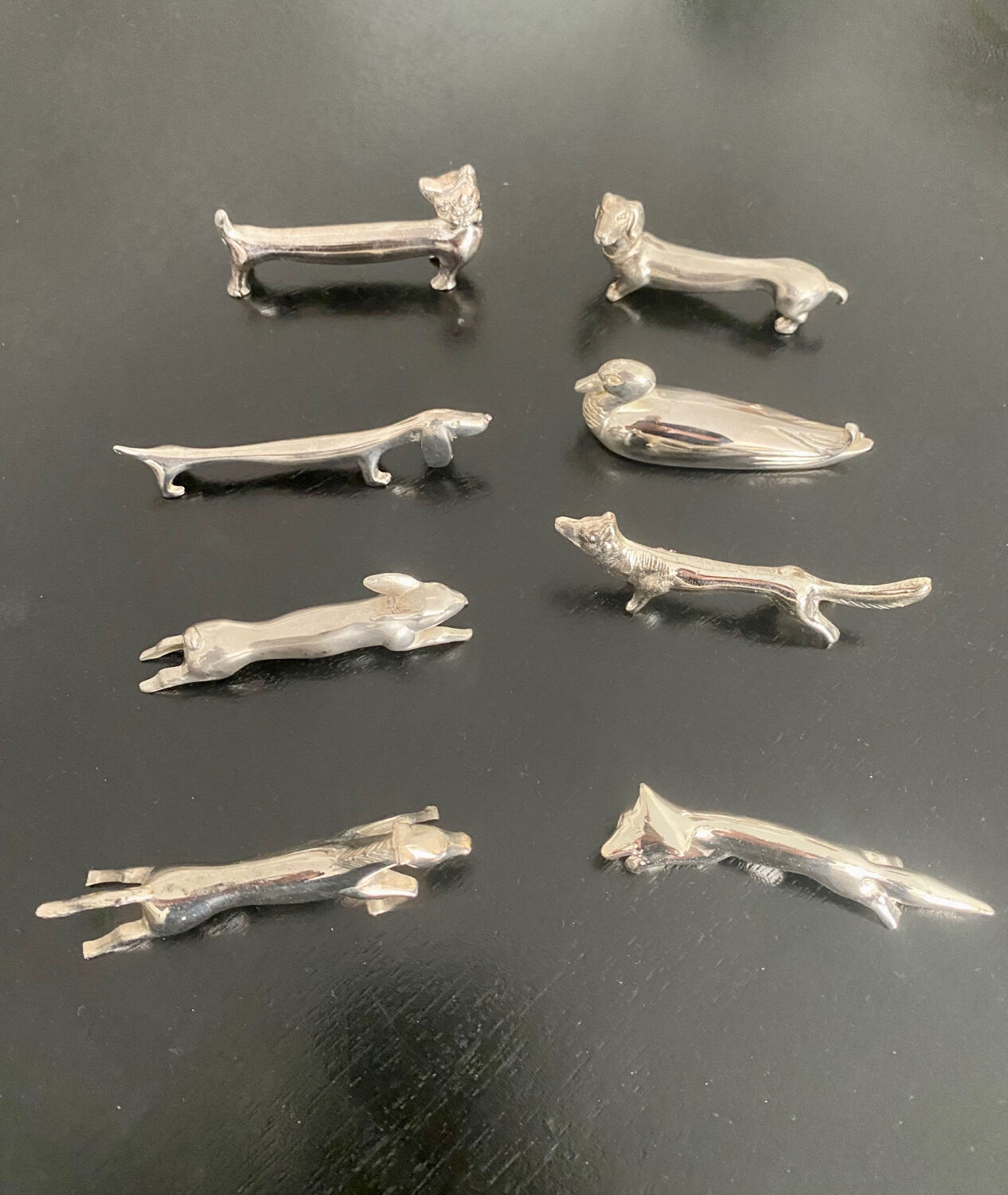 8 various animal knife holders in silver metal