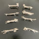 8 various animal knife holders in silver metal