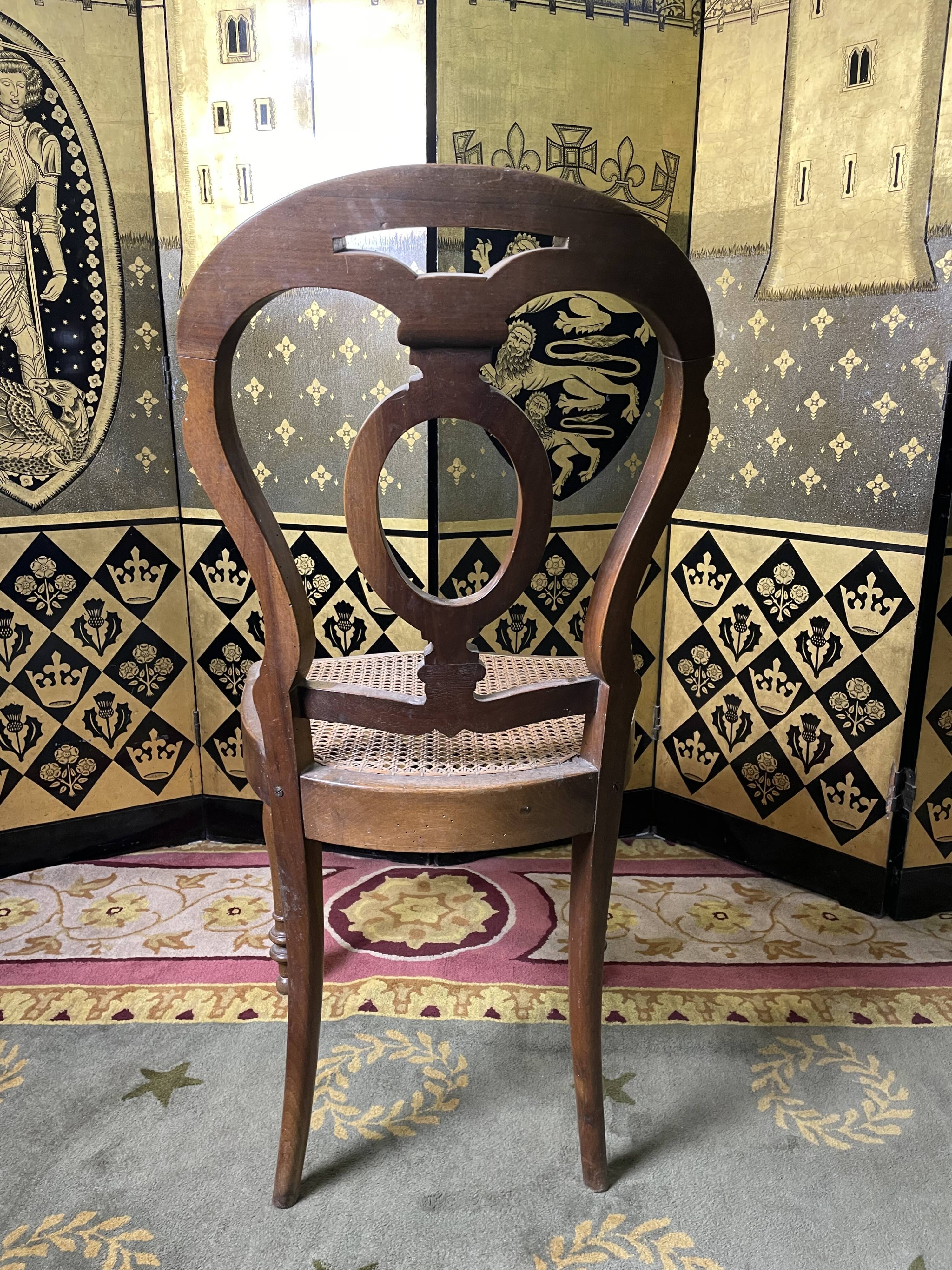 Suite of 12 Louis Philippe period chairs in walnut and canning