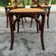 4 bistro chairs with curved wooden backs and cross braces / Crossback