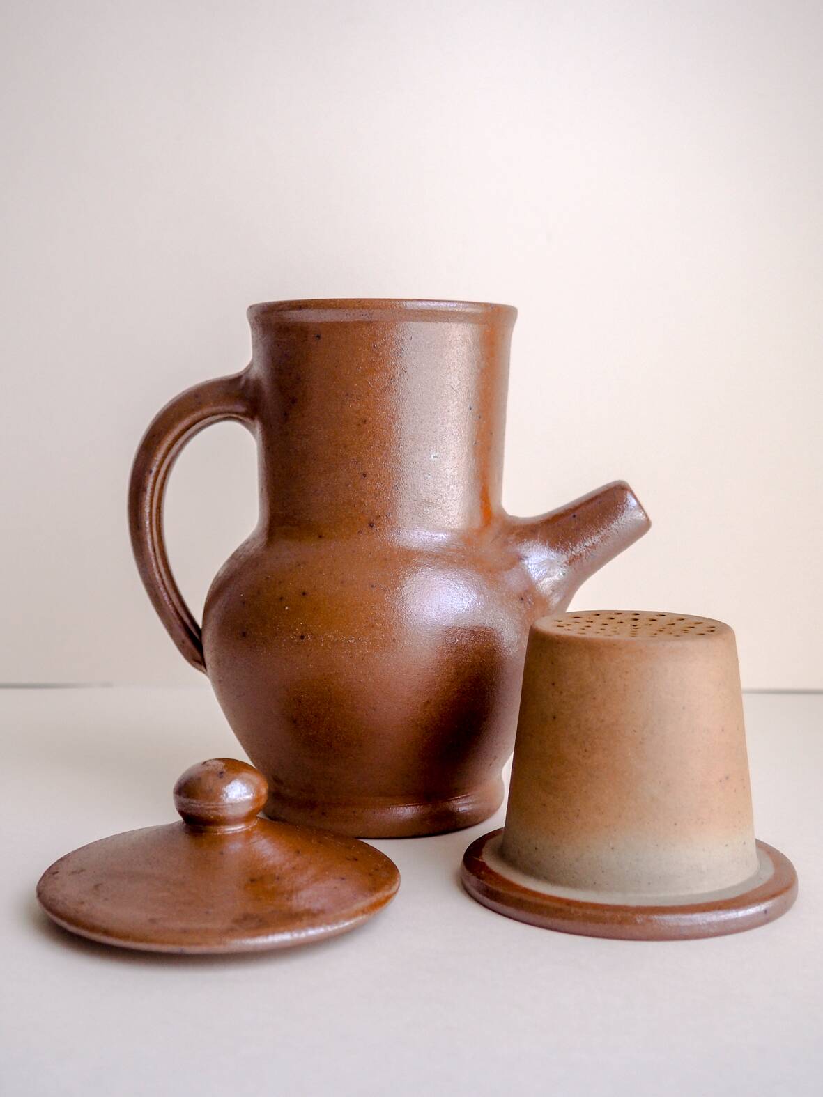 Handcrafted stoneware teapot with strainer