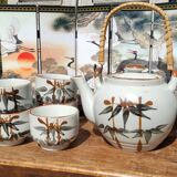 Asian set of a teapot and its cups