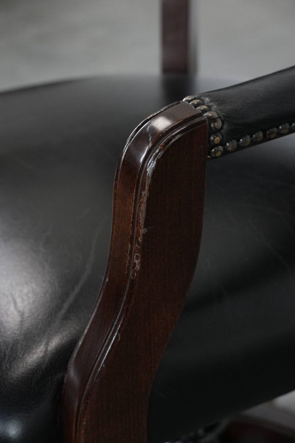 Adjustable black timeless Chesterfield office chair made of cow leather