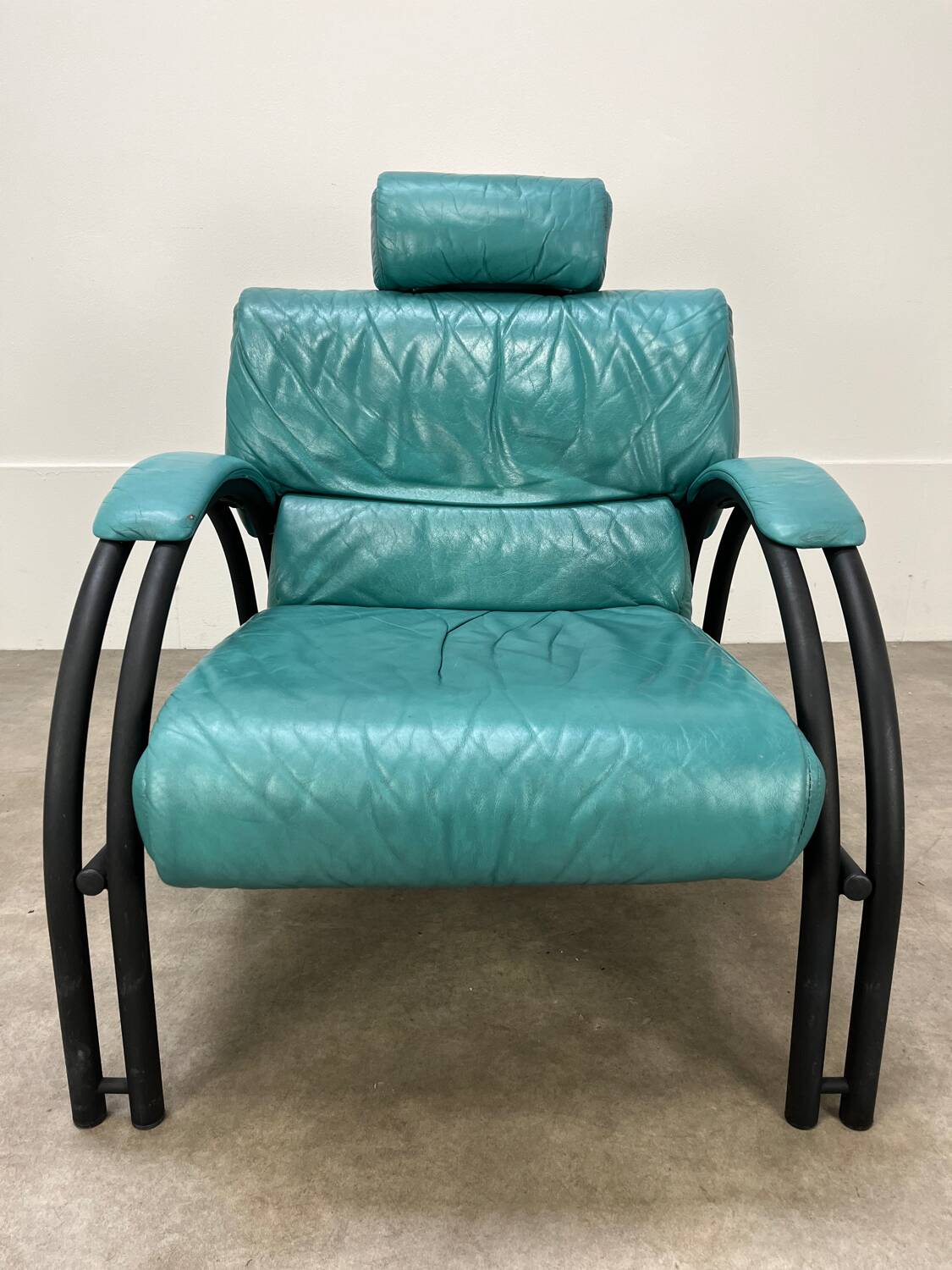 Postmodern design armchair and ottoman, 80s leather