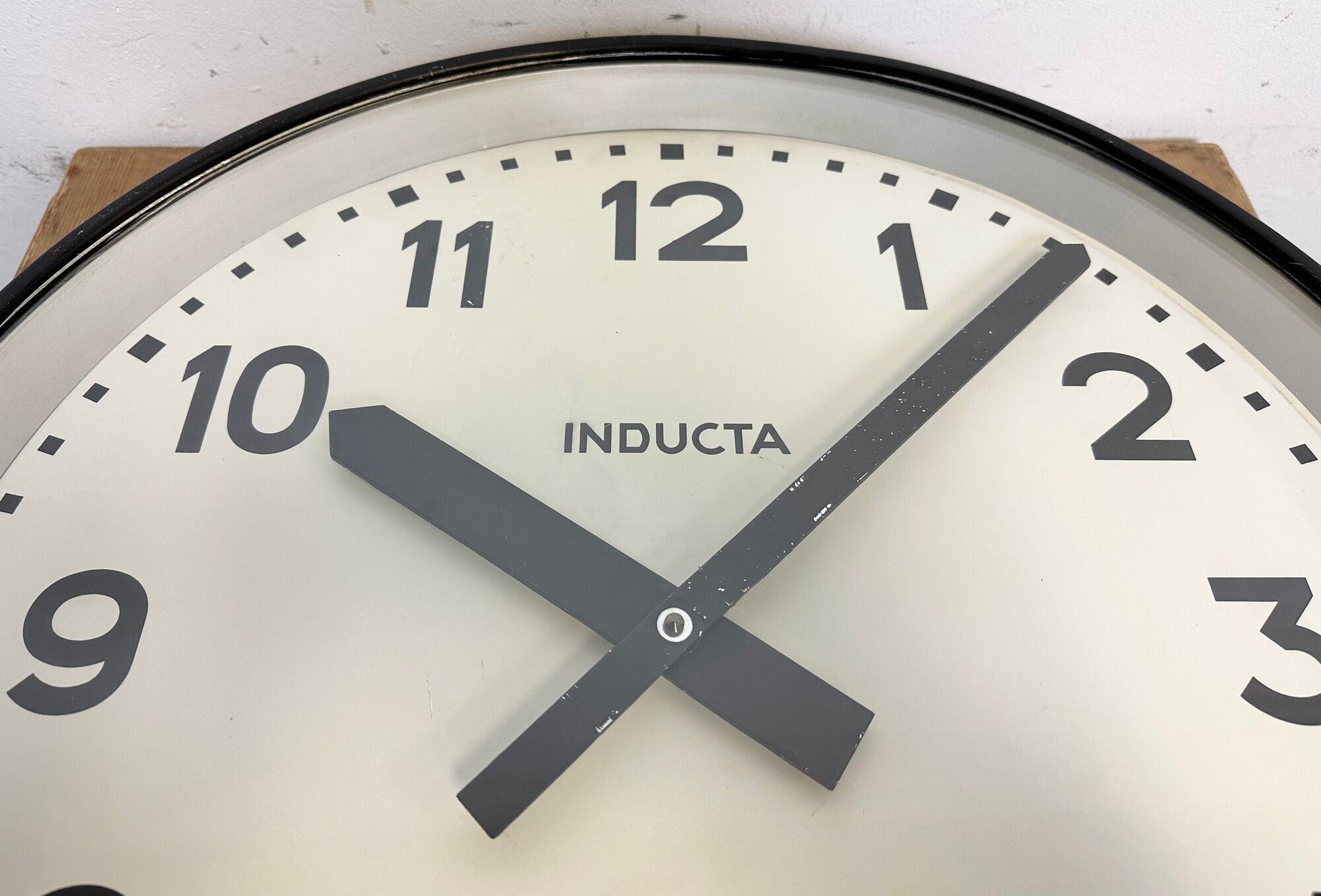 Black swiss industrial wall clock from inducta, 1960s