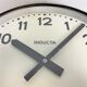 Black swiss industrial wall clock from inducta, 1960s