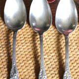 A set of 6 silver-plated metal soup spoons with foliage design.