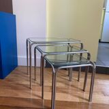 Nesting tables in chrome metal and white glass