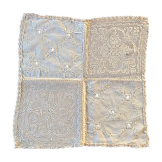 Former embroidered doily
