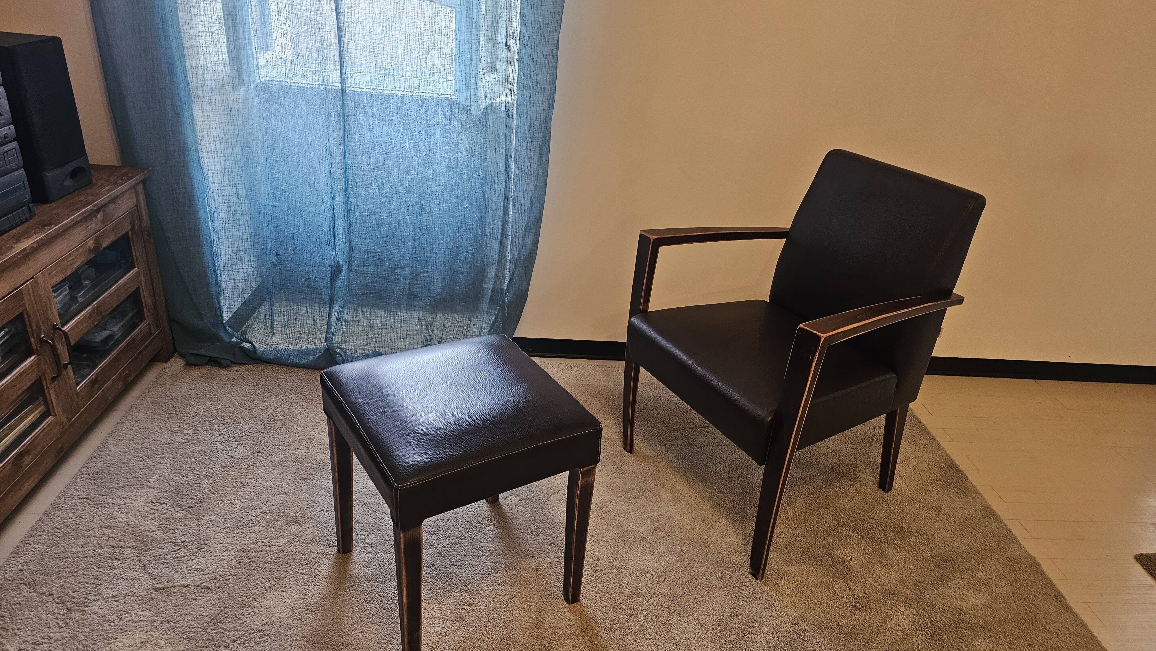 Armchair and faux leather footrest