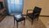 Armchair and faux leather footrest
