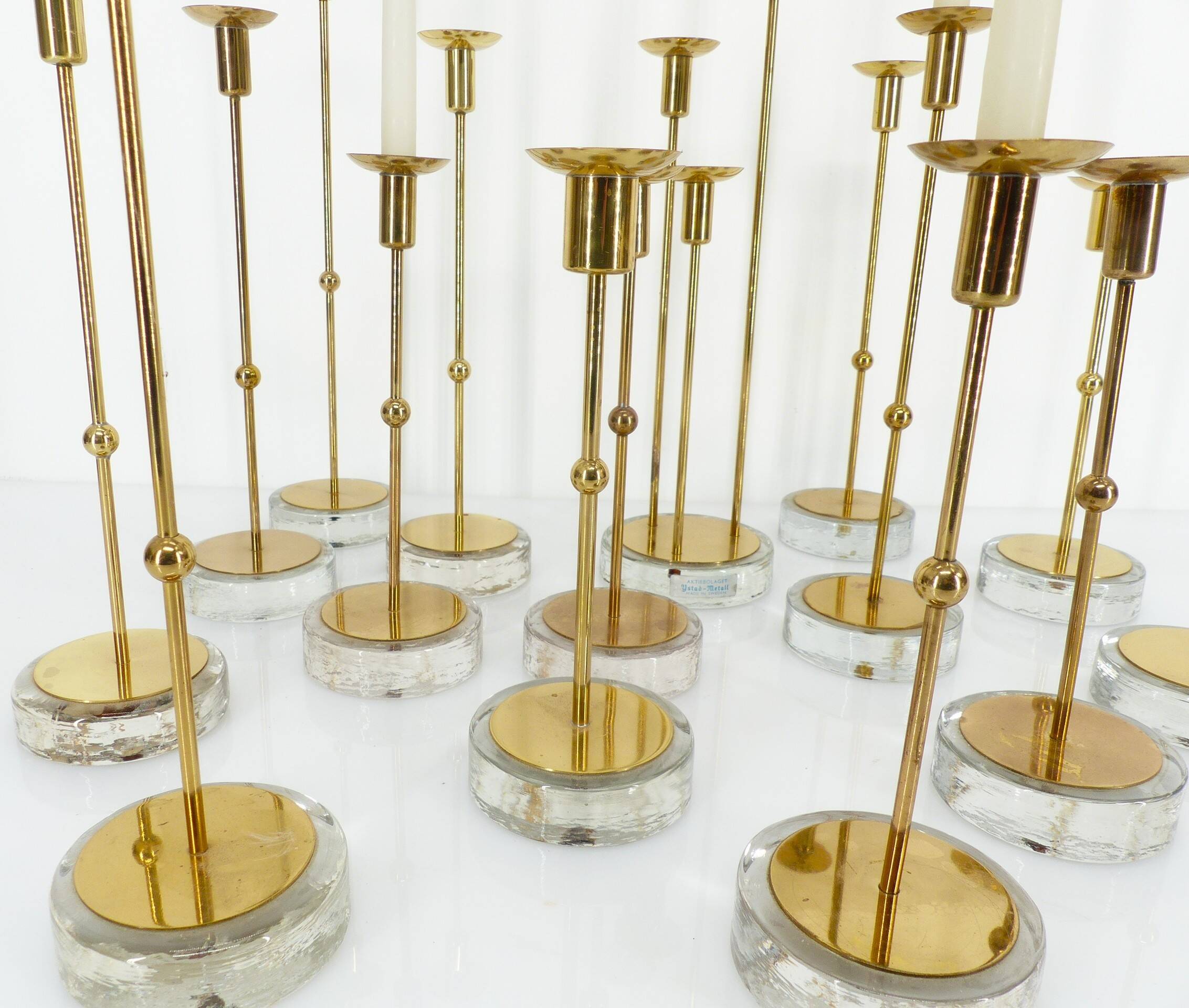 Set of 15 Scandinavian candle holders in brass and glass, Gunnar Ander, Ystad Met