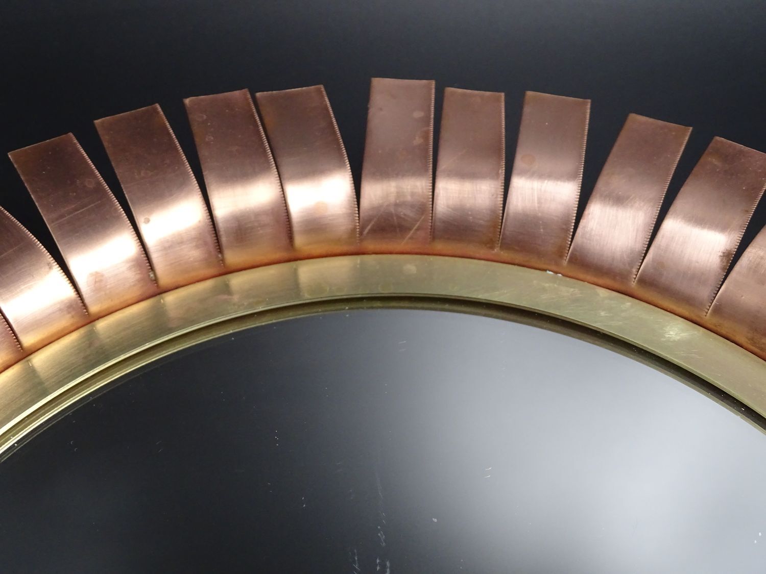 Round mirror in cut copper, sun-shaped  1970
