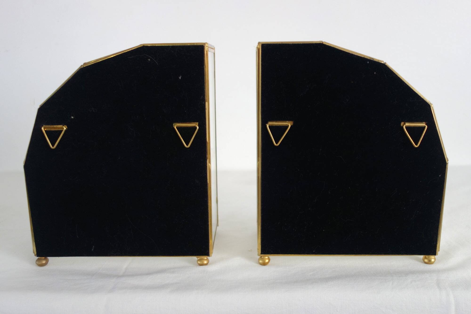 Pair of gilded brass, glass, mirror display cases from the 60s
