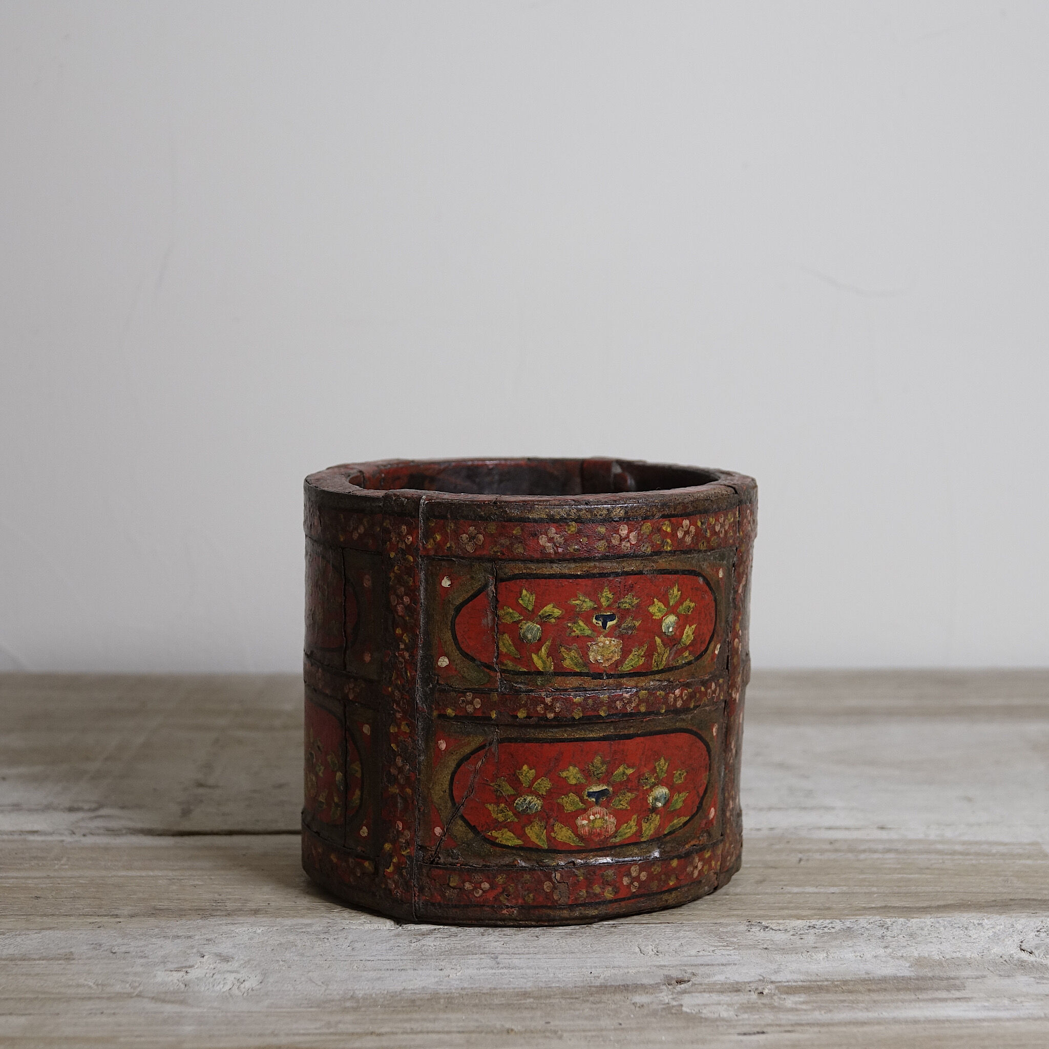Antique wooden pot painted by hand