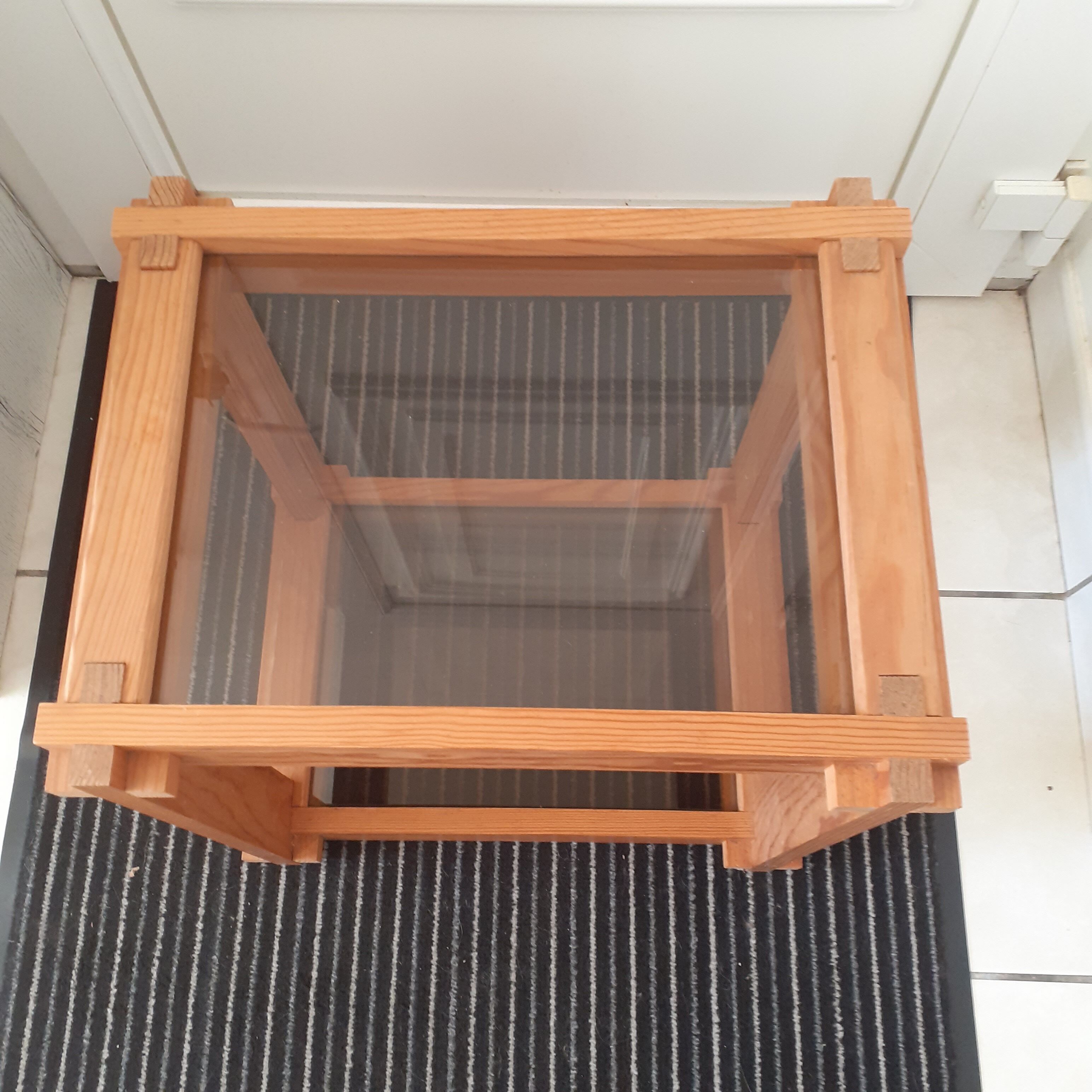 Light solid wood side table. 2 dyed glass shelves.