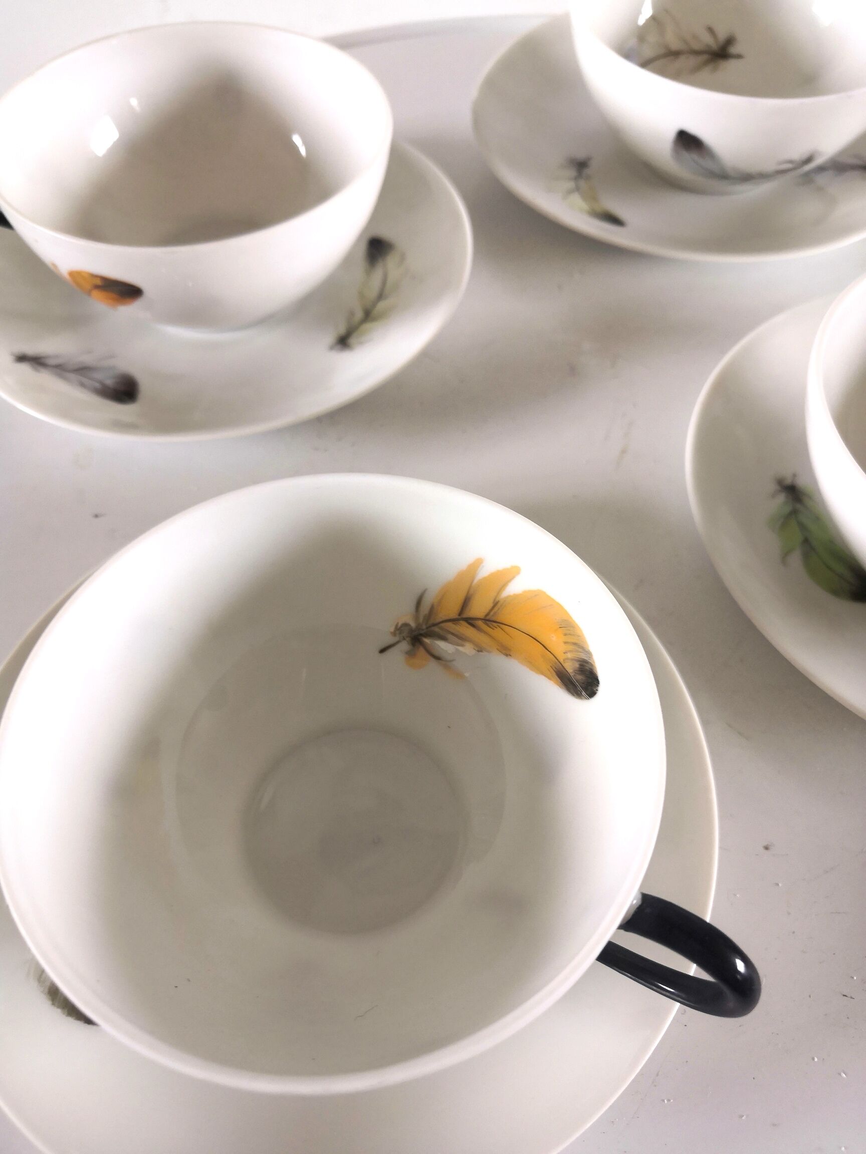 4 cups and cups in fine Limoges porcelain signed LC 60s