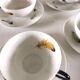 4 cups and cups in fine Limoges porcelain signed LC 60s