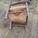 Low straw fireplace armchair in Dudouyt style