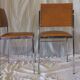 Pair of modernist chairs in chromed metal and imitation leather
