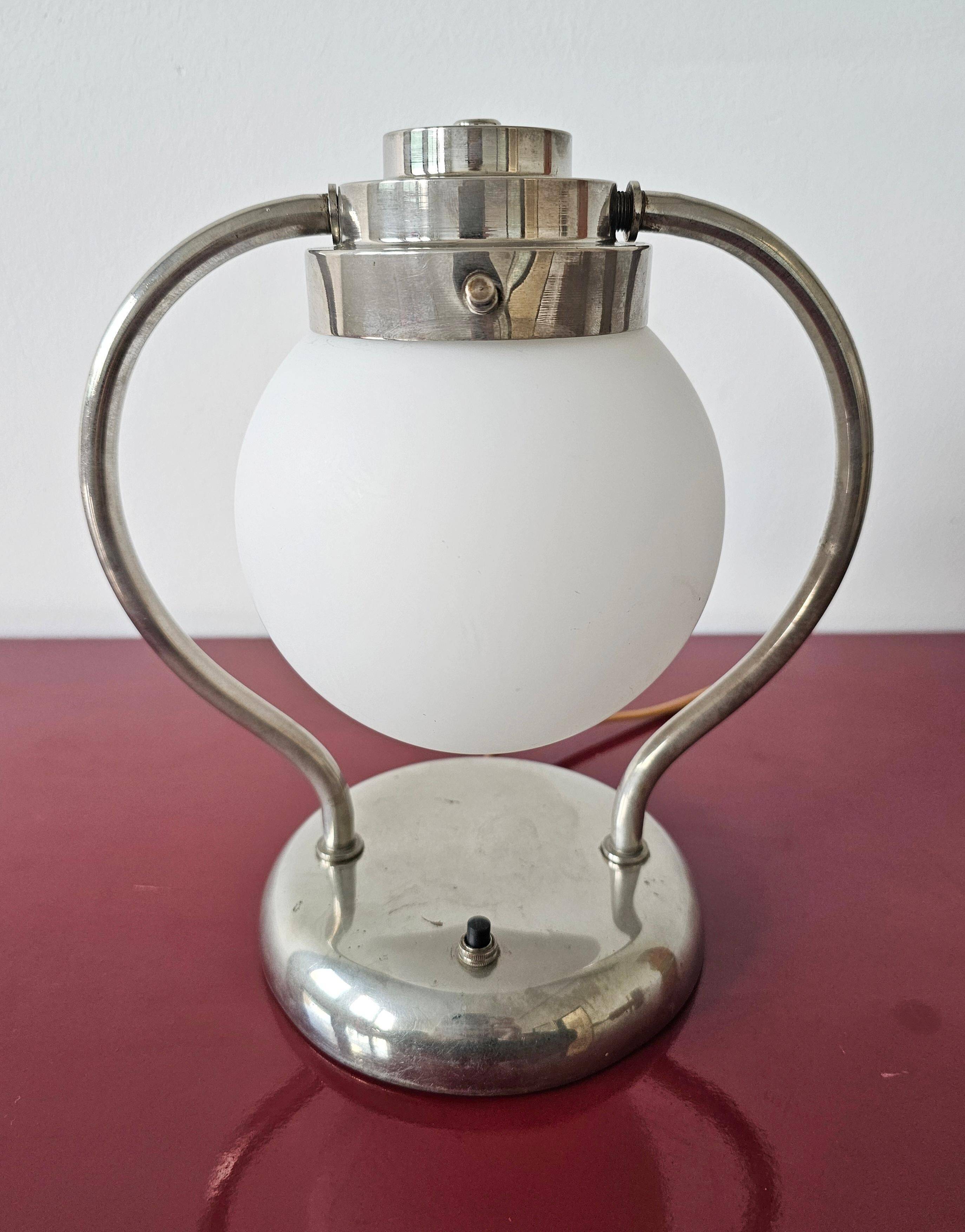 Art Deco table lamp with a spherical opaline glass shade and chrome base from the 1930s.