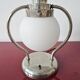 Art Deco table lamp with a spherical opaline glass shade and chrome base from the 1930s.