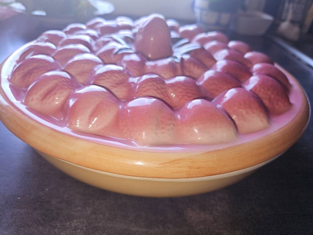Glazed ceramic dessert plate with strawberry design.
